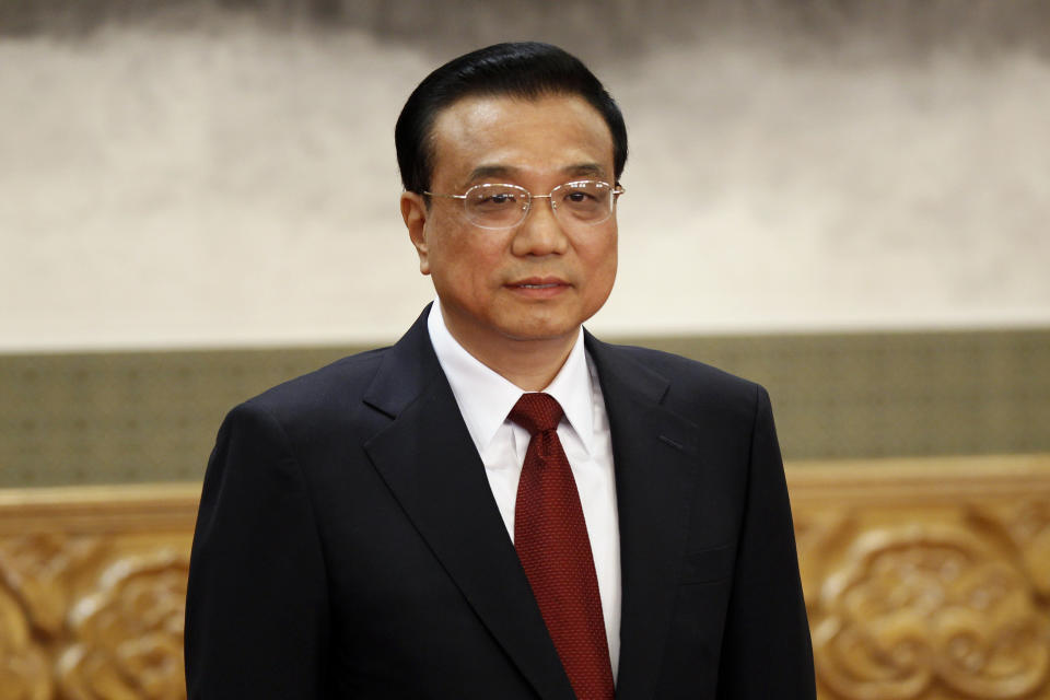 Li Keqiang, one of the seven newly elected members of the Politburo Standing Committee, attends a press event at Beijing's Great Hall of the People, Thursday Nov. 15, 2012. The seven-member Standing Committee, the inner circle of Chinese political power, was paraded in front of assembled media on the first day following the end of the 18th Communist Party Congress. (AP Photo/Vincent Yu)