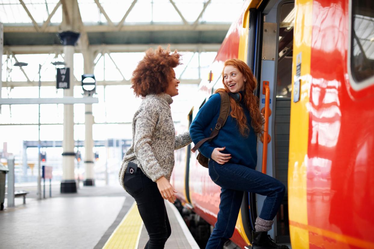 two women boarding a train