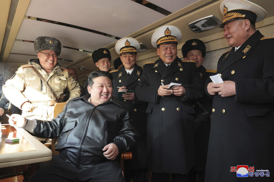 In this photo provided by the North Korean government, North Korean leader Kim Jong Un, front left, provides direction as it conducts a test firing of what it says surface-to-sea missiles in North Korea Wednesday, Feb. 14, 2024. Independent journalists were not given access to cover the event depicted in this image distributed by the North Korean government. The content of this image is as provided and cannot be independently verified. Korean language watermark on image as provided by source reads: "KCNA" which is the abbreviation for Korean Central News Agency. (Korean Central News Agency/Korea News Service via AP)