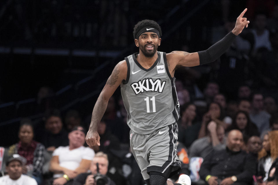Brooklyn Nets guard Kyrie Irving gestures after a basket during the first half of the team's NBA basketball game against the Houston Rockets, Friday, Nov. 1, 2019, in New York. (AP Photo/Mary Altaffer)