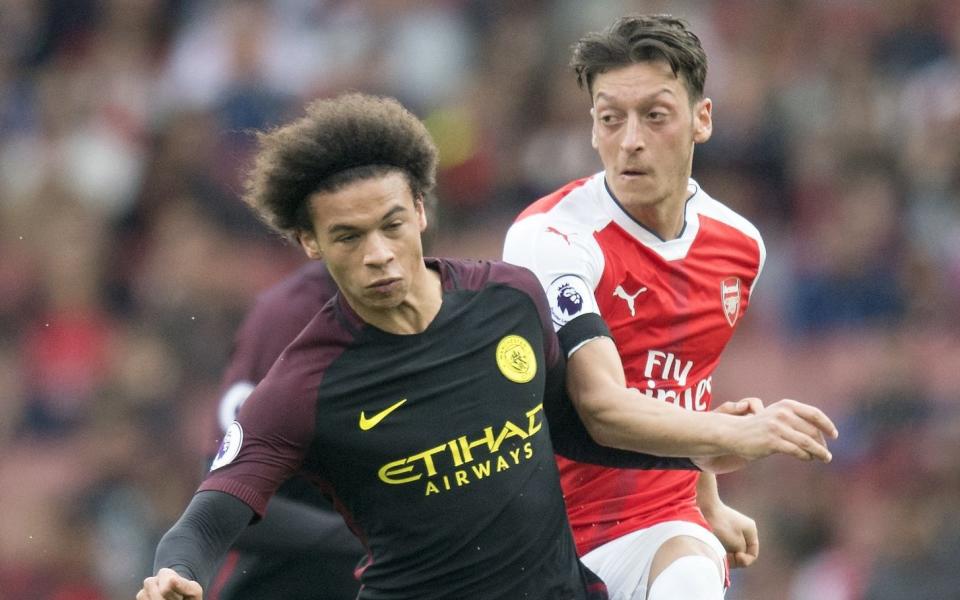 Letor sane and Mesut Ozil - Credit: Rex Features