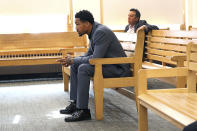 New England Patriots cornerback Jack Jones is seated at his arraignment on gun charges at East Boston Municipal Court, Tuesday, June 20, 2023, in Boston, Mass. Jones was charged with carrying two loaded guns in his carry-on luggage at Logan Airport. (Suzanne Kreiter/The Boston Globe via AP, Pool)