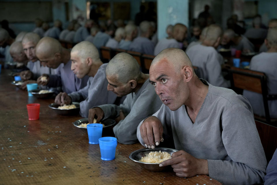 Drug addicts undergoing treatment eat in a dining hall of a drug treatment camp, in Kabul Afghanistan, Monday, May 30, 2022. Drug addiction has long been a problem in Afghanistan, the world’s biggest producer of opium and heroin. The ranks of the addicted have been fueled by persistent poverty and by decades of war that left few families unscarred. (AP Photo/Ebrahim Noroozi)