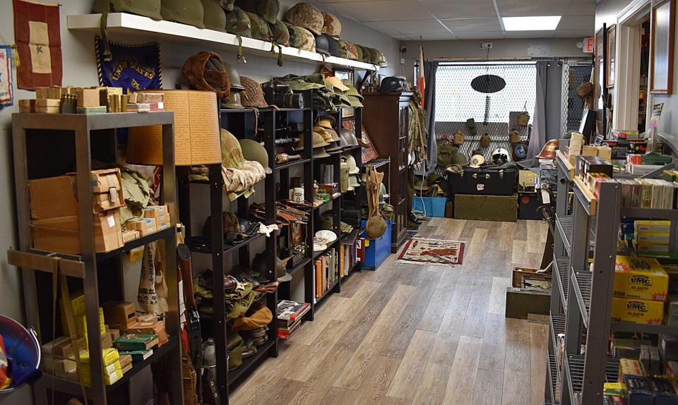 The showroom at Collectable Firearms & Militaria on Rhode Island Avenue in Fall River is full of antique military gear from wars throughout American history.