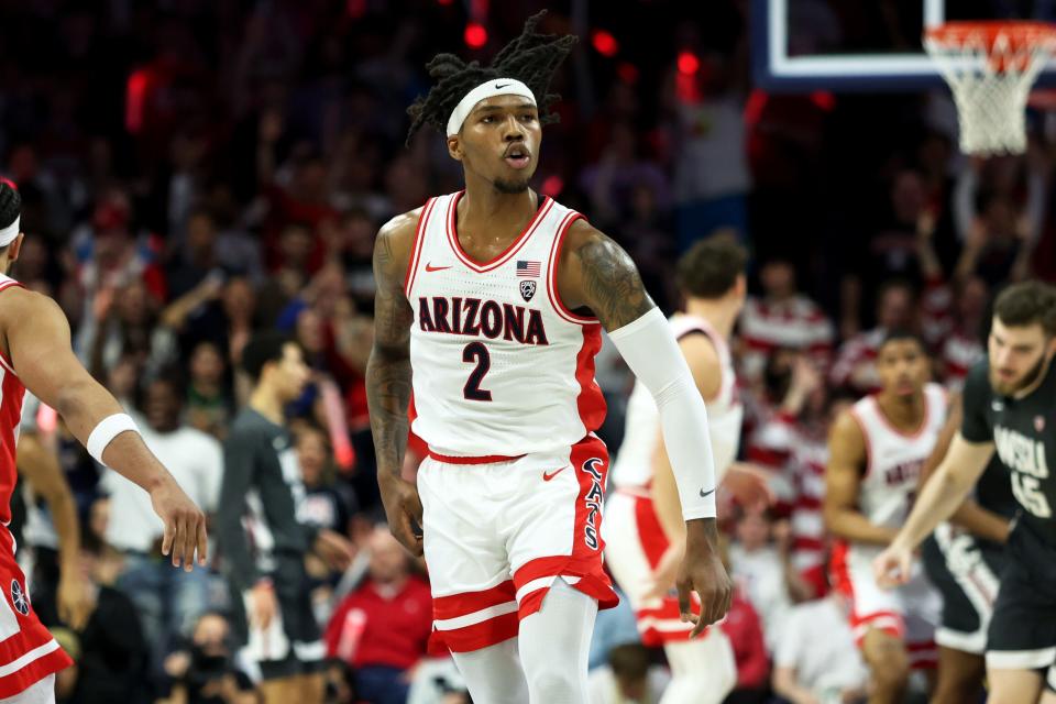 Arizona Wildcats guard Caleb Love (2) celebrates after scoring a three point basket against the Washington State Cougars during the first half at McKale Center.