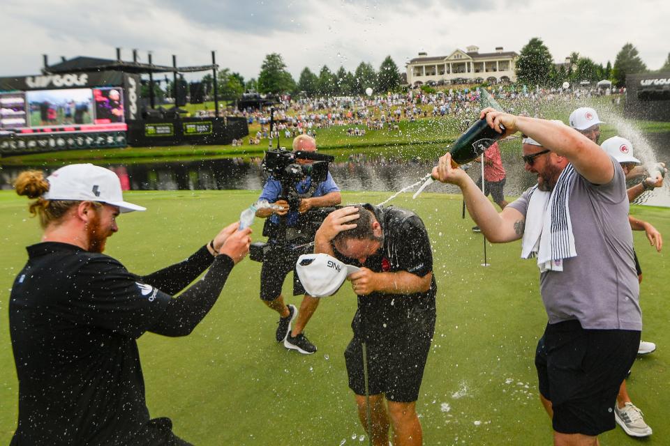 Tyrrell Hatton of Legion XIII gets soaked in champagne at The Grove. Mandatory Credit: Steve Roberts-USA TODAY Sports