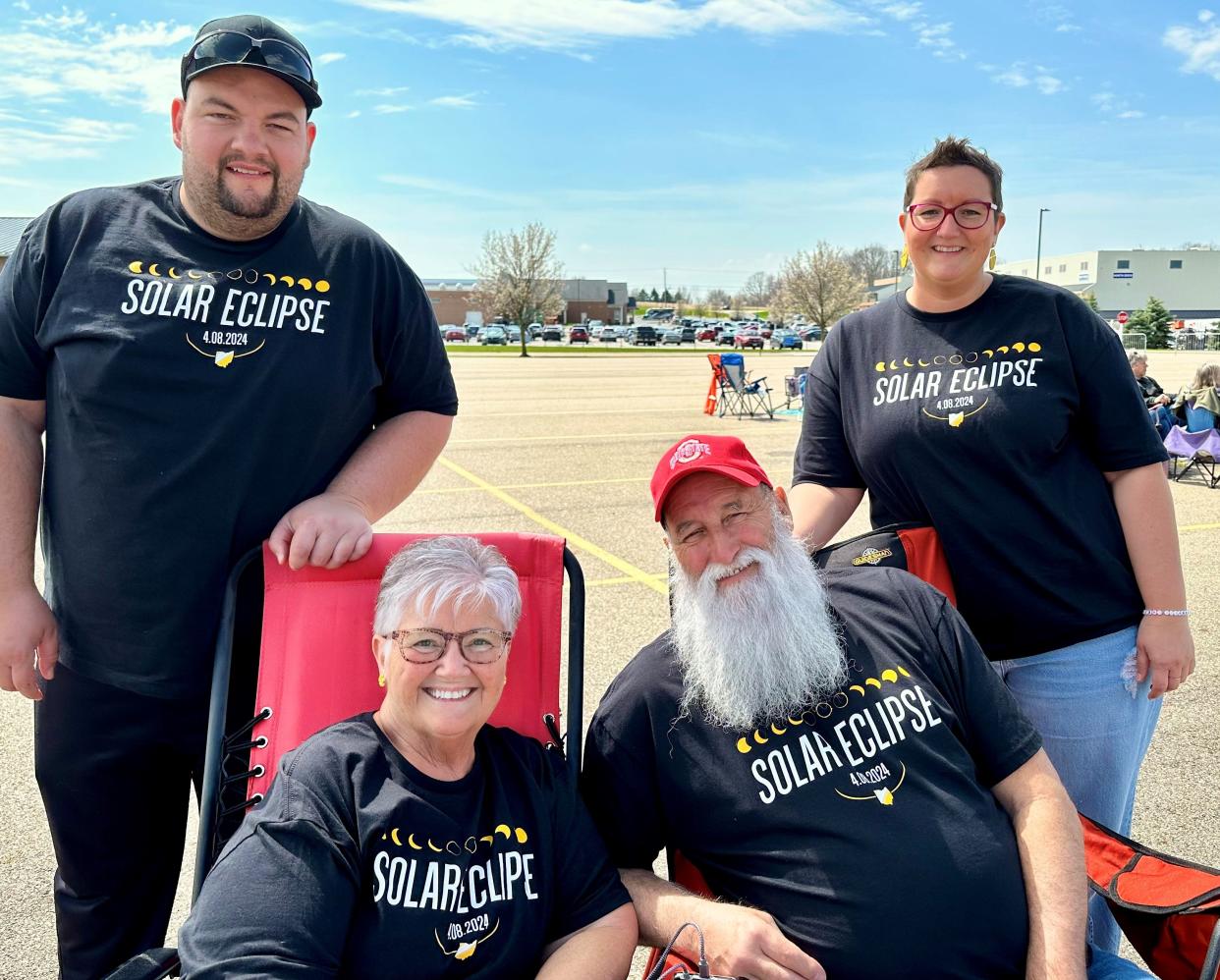 Wearing their solar eclipse-themed shirts, the Doll family from Plain Township visited the Hartville MarketPlace Monday to view the total solar eclipse. The family includes, from left, Nicholas Doll, Elain Doll, Richard Doll and Stephanie Doll.