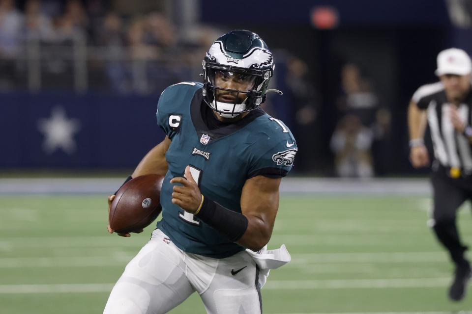 Philadelphia Eagles quarterback Jalen Hurts (1) runs the ball in the second half of an NFL football game against the Dallas Cowboys in Arlington, Texas, Monday, Sept. 27, 2021. (AP Photo/Ron Jenkins)