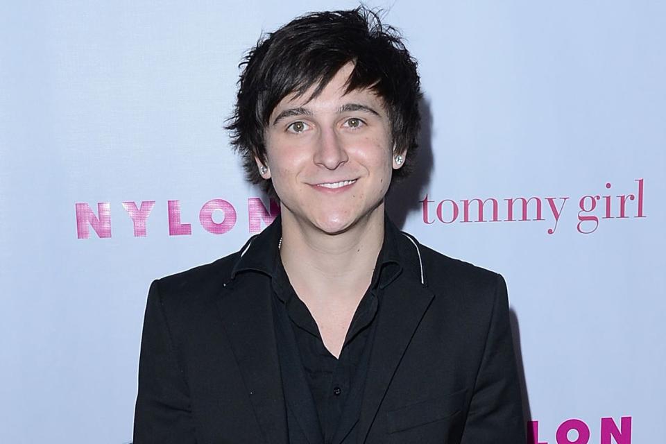 <p>Jason Merritt/Getty</p> Mitchel Musso attends the NYLON Magazine Annual May Young Hollywood Issue party in 2012.