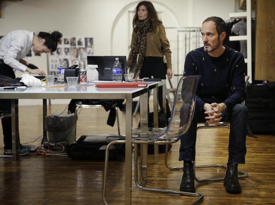 In this Monday, Feb. 3, 2014 photo, Josep Font, creative director of DelPozo, right, works with his team during a model casting in New York. (AP Photo/Seth Wenig)