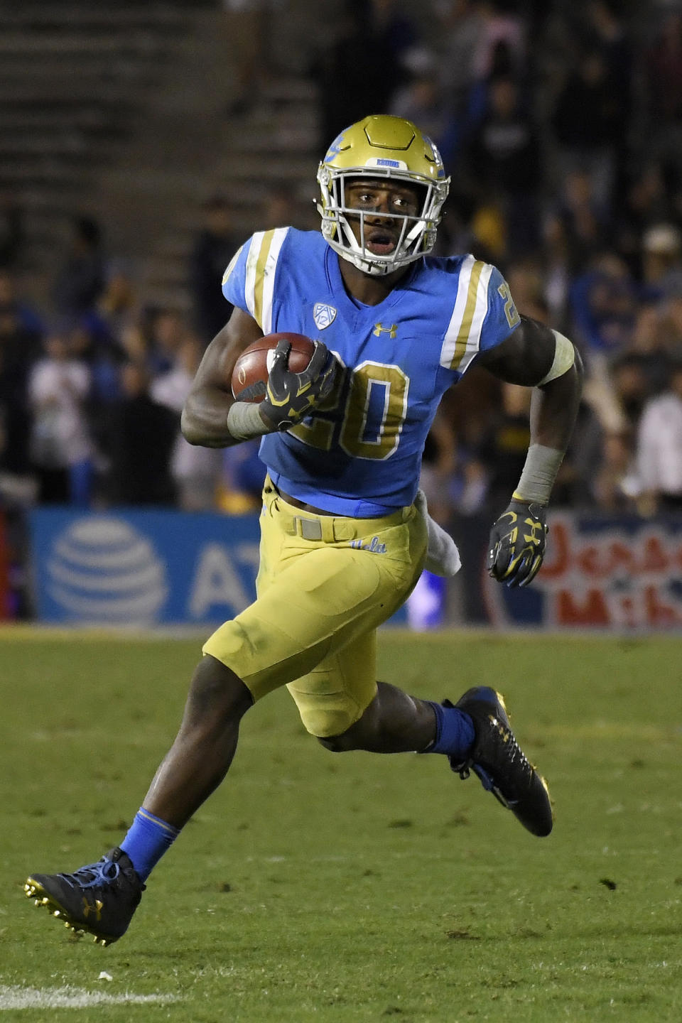 FILE - In this Nov. 24 ,2017, file photo, UCLA running back Brandon Stephens runs against California during the second half of an NCAA college football game, in Los Angeles. Stephens, from Plano, Texas, is back in Texas after transferring to SMU. (AP Photo/Mark J. Terrill, File)