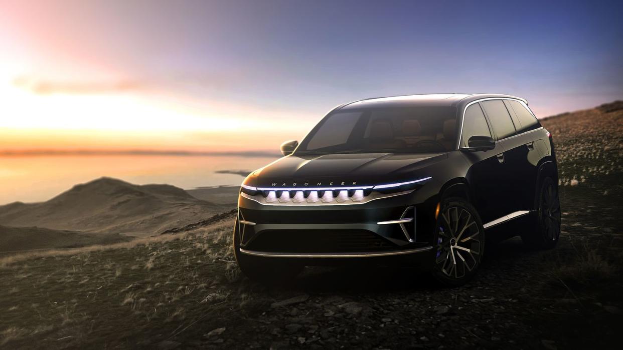 2024 black jeep wagoneer s parked overlooking the ocean at sunrise