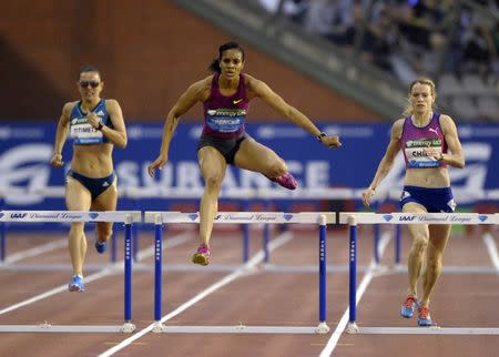 Kaliese Spencer (C) of Jamaica wins the women's 400 metres hurdles during the IAAF Diamond League athletics meet, also known as Memorial Van Damme, in Brussels September 5, 2014. REUTERS/Laurent Dubrule