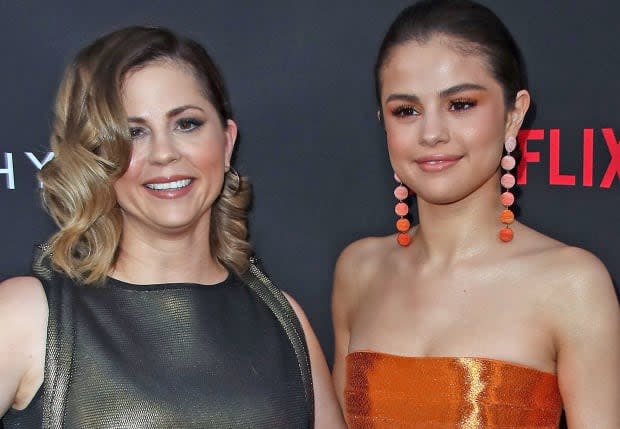 Mandy Teefey and Selena Gomez attend the premiere of <a href="https://parade.com/1015716/samuelmurrian/best-movies-on-netflix/" rel="nofollow noopener" target="_blank" data-ylk="slk:Netflix;elm:context_link;itc:0;sec:content-canvas" class="link ">Netflix</a>'s "13 Reasons Why" at Paramount Pictures on March 30, 2017, in Los Angeles.<p>David Livingston/Getty Images</p>