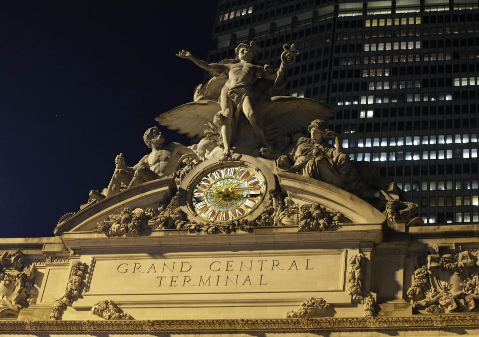 The mythological figures Hercules, Mercury, and Minerva adorn the main facade of Grand Central Terminal, part of a sculptural group created by Jules Alexis, atop the terminal in New York, Tuesday, Jan. 8, 2013. Constructed in 1913 by the Vanderbilt family, railroad barons and wealthy industrialists, the terminal is the country's most famous train station and one of the finest examples of Beaux Arts architecture in America. The building turns 100 on Feb. 1st. (AP Photo/Kathy Willens)