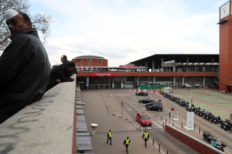 Members of the Military Emergency Unit (UME) patrol at Atocha train station during partial lockdown as part of a 15-day state of emergency to combat the coronavirus (COVID-19) spread in Madrid