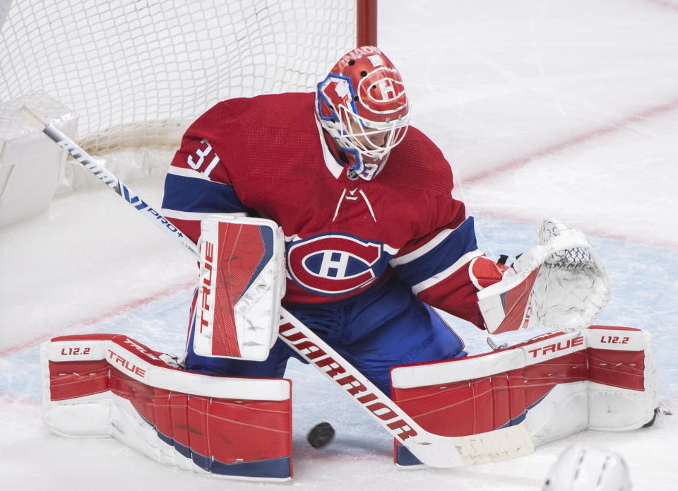 Montreal Canadiens goaltender Carey Price is scored against by Ottawa Senators' Drake Batherson, not shown, during second-period NHL hockey game action in Montreal, Saturday, April 17, 2021. (Graham Hughes/The Canadian Press via AP)