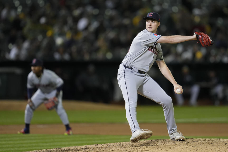 Cleveland Guardians pitcher Tim Herrin throws to an Oakland Athletics batter during the eighth inning of a baseball game Thursday, March 28, 2024, in Oakland, Calif. (AP Photo/Godofredo A. Vásquez)