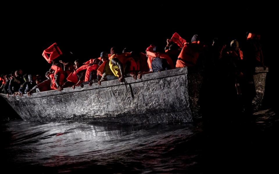 The wooden boat was adrift in Tunisian waters on Wednesday - AP