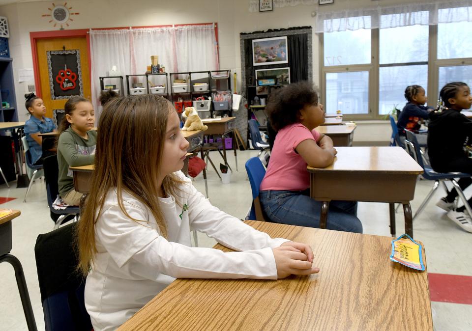 Worley Elementary School second grader Avyanna Mullins and her classmates listen to music at the start of the school day. The Canton school began using the Mindful Music Moments program this fall.