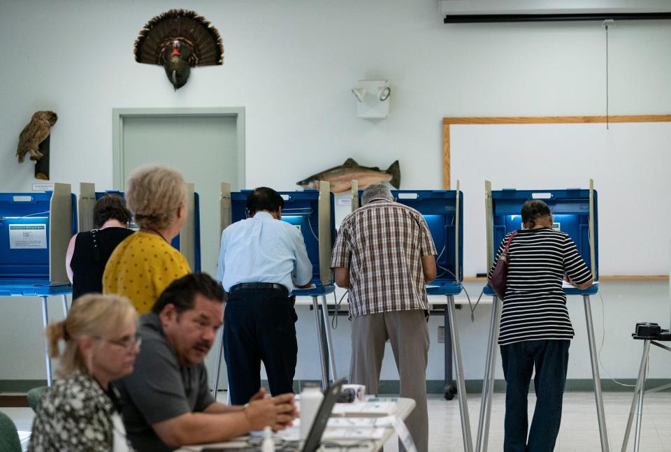 A steady stream of voters fill out ballots at the Lloyd A. Stage nature center in Troy during the Michigan primary, Tuesday, Aug. 2, 2022.