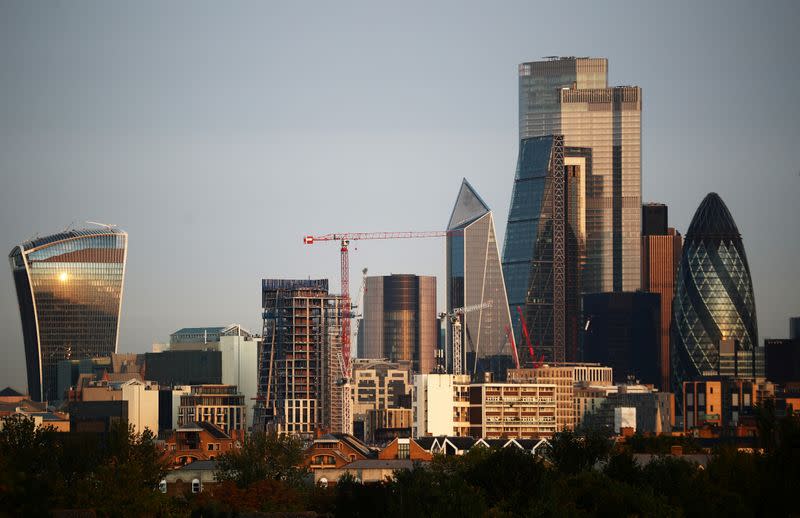 FILE PHOTO: Skyscrapers in The City of London financial district are seen during sunrise in London