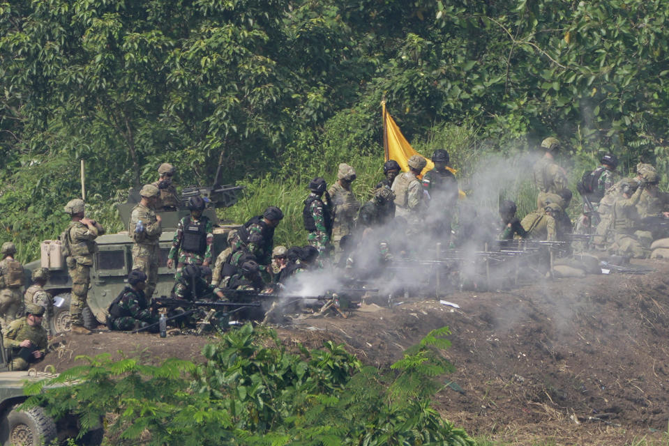 U.S. and Indonesian soldiers engage targets with their heavy machine guns during Super Garuda Shield 2022 joint military exercises in Baturaja, South Sumatra, Indonesia, Friday, Aug. 12, 2022. The United States and Indonesian militaries conducted the annual combat exercises on Indonesia's Sumatra island, joined for the first time by participants from other partner nations including Australia, Japan and Singapore, signaling stronger ties amid growing maritime activity by China in the Indo-Pacific region. (AP Photo/Dita Alangkara)