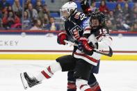 United States' Kacey Bellamy (22) defends against Canada's Mélodie Daoust (15) during the second period of a rivalry series women's hockey game in Hartford, Conn., Saturday, Dec. 14, 2019. (AP Photo/Michael Dwyer)