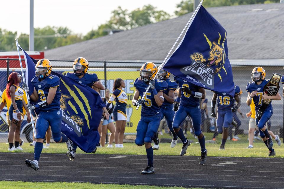 Riley players come onto the field prior to the South Bend Adams-South Bend Riley high school football game on Friday, September 02, 2022, at Jackson Field in South Bend, Indiana.