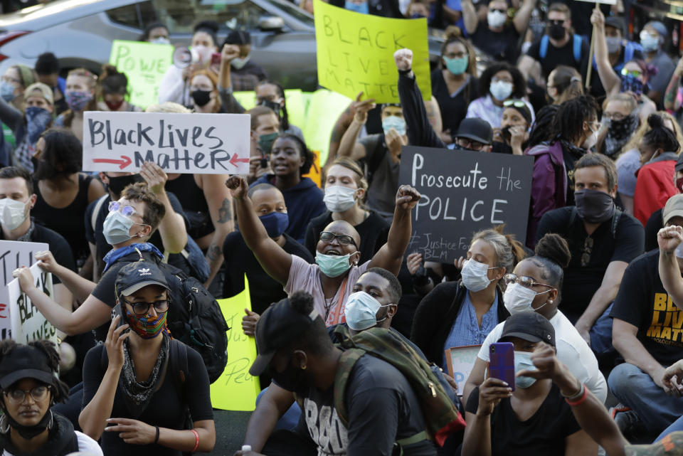 Protesters gather to protest the death of George Floyd and Breonna Taylor, Friday, May 29, 2020, in Louisville, Ky. Taylor, a black woman, was fatally shot by police in her home in March. (AP Photo/Darron Cummings)