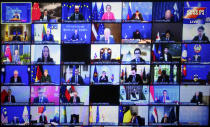 Officials are seen on screen during an online opening session of the Asia-Europe Meeting (ASEM) in Phnom Penh, Cambodia, Thursday, Nov. 25, 2021. Cambodian Prime Minister Hun Sen on Thursday welcomed leaders of Asian and European nations to the 13th biennial Asia-Europe Meeting, held virtually and postponed from last year due to the coronavirus pandemic. (AP Photo/Heng Sinith)