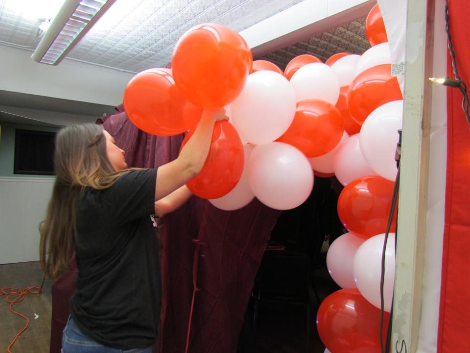 Foundry manager Brittany Rodriguez setting up a balloon tunnel for the interactive haunted house on Sept. 27, 2023.