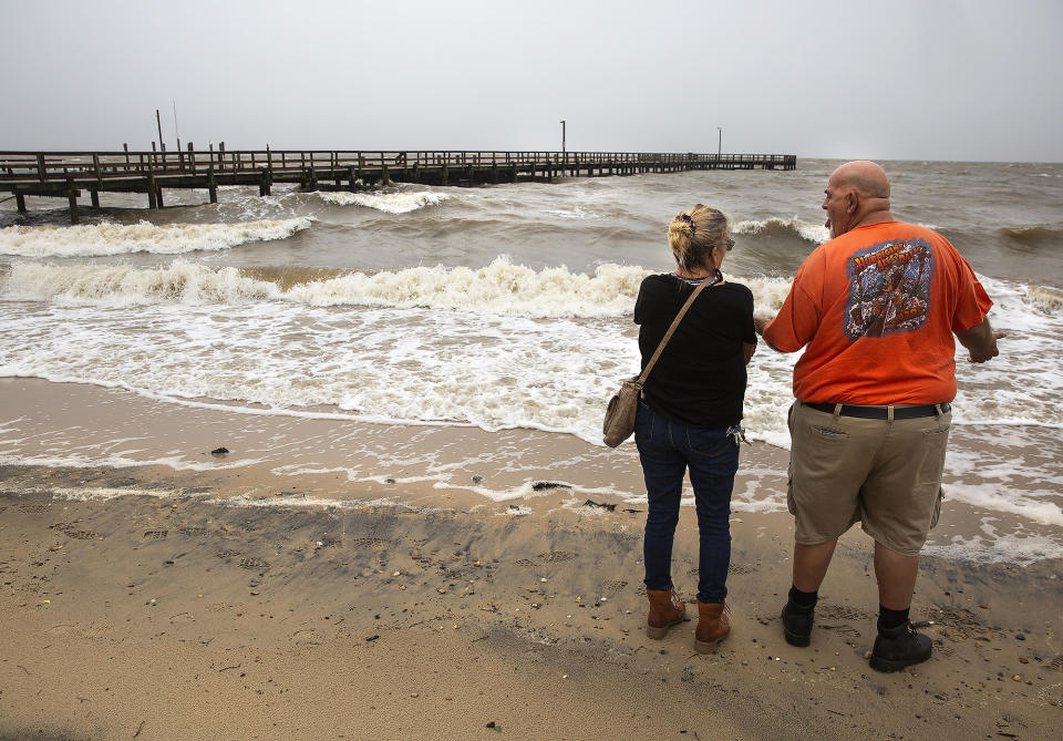 Doris and Warren Todd watch as Tropical Storm Ophelia passes over Colonial Beach in Westmoreland County, Va., on Saturday, Sept. 23, 2023. The couple had just celebrated their 34th wedding anniversary after marrying on Sept. 22, 1989, when hurricane Hugo made landfall in North Carolina. (Peter Cihelka/The Free Lance-Star via AP)