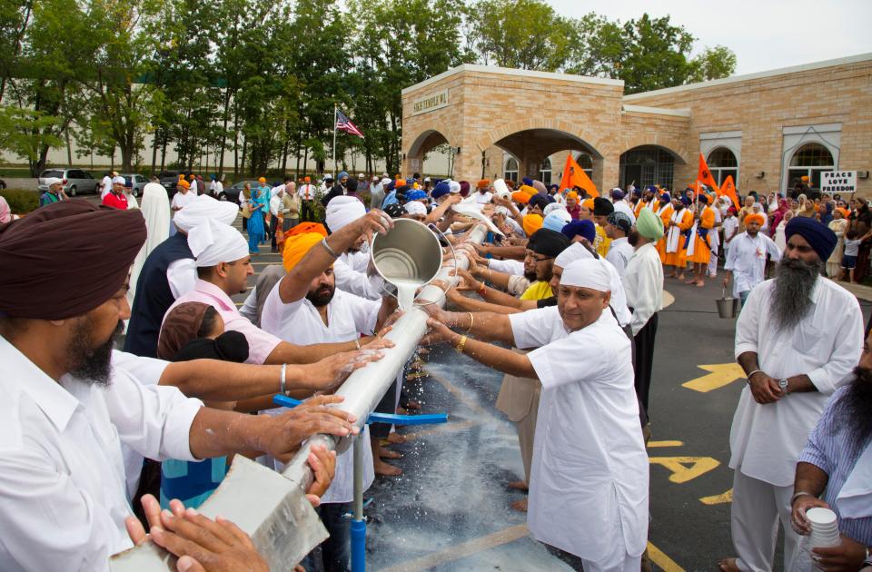 A flag ceremony at the Sikh Temple of Wisconsin in Oak Creek on Aug. 12, 2012, a week after a gunman killed six worshipers.