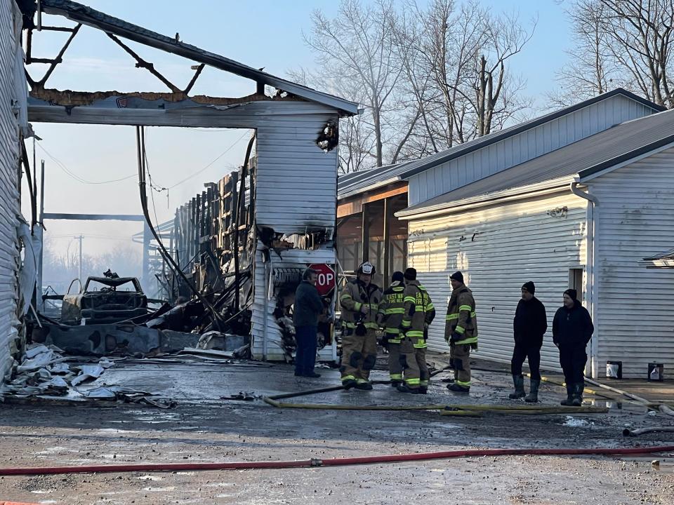 East Wayne firefighters remained at the scene of a fire Wednesday morning that destroyed Len Zermenos, a Dalton family-run business that makes tow truck rollbacks. The fire broke out just after midnight and kept firefighters busy through the early morning hours.