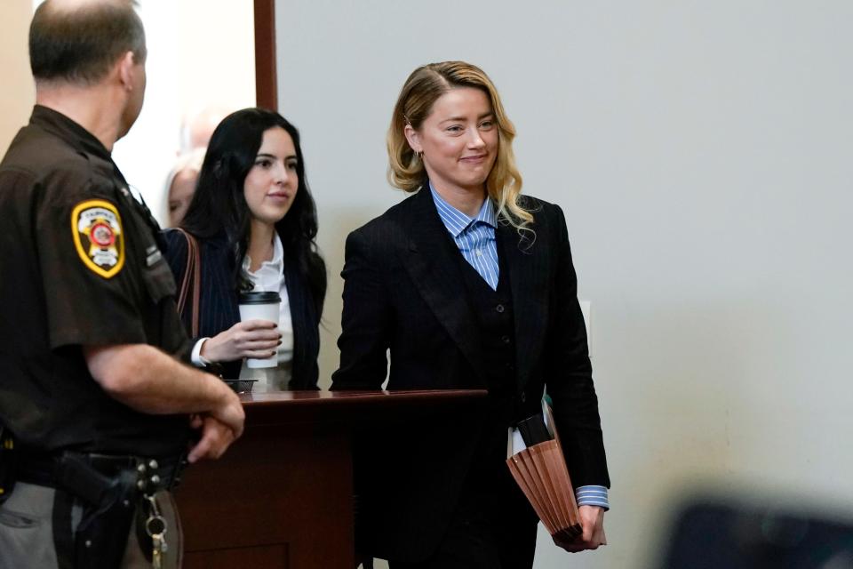 Actor Amber Heard arrives in the courtroom at the Fairfax County Circuit Court in Fairfax, Va., Wednesday May 4, 2022. Actor Johnny Depp sued his ex-wife Amber Heard for libel in Fairfax County Circuit Court after she wrote an op-ed piece in The Washington Post in 2018 referring to herself as a "public figure representing domestic abuse."