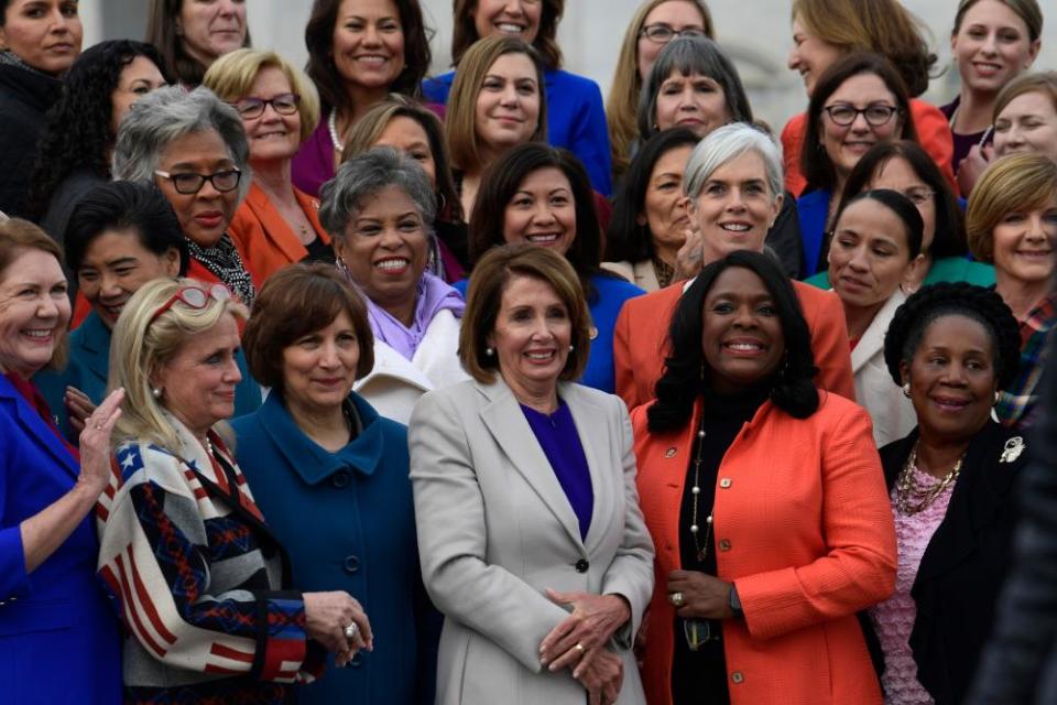 The women of the 116th Congress, including House Speaker Nancy Pelosi, center front row, pose for a group photo on Capitol Hill in Washington.