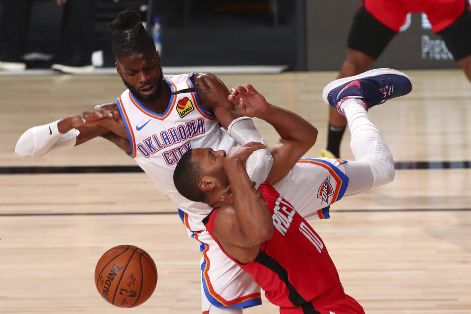 Oklahoma City Thunder center Nerlens Noel, top, fouls Houston Rockets guard Eric Gordon (10) during the third quarter of Game 2 of an NBA basketball first-round playoff series, Thursday, Aug. 20, 2020, in Lake Buena Vista, Fla. (Kim Klement/Pool Photo via AP)