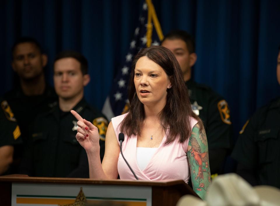 Nikki Jones , whose husband was killed in an automobile crash with an illegal immigrant, speaks during a press conference with Gov. Ron DeSantis at the Polk County Sheriff's Operations Center in Winter Haven on Friday.