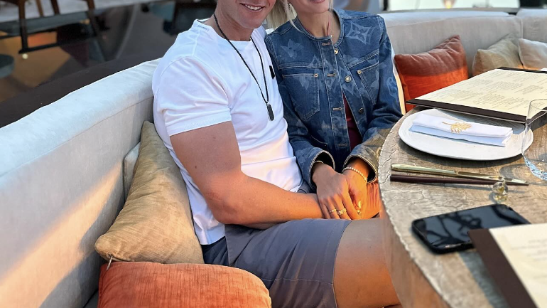 a man and woman sitting at a table in a restaurant