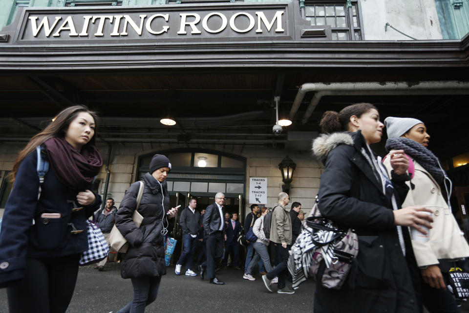 Commuters make their way through Hoboken Terminal in Hoboken, N.J., Wednesday, April 5, 2017. Train passengers are facing delays while repairs continue days after a commuter train derailment inside New York City's Penn Station. (AP Photo/Seth Wenig)