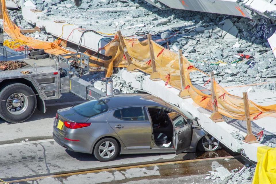 Rescue: other drivers dragged people from their crushed cars (EPA)