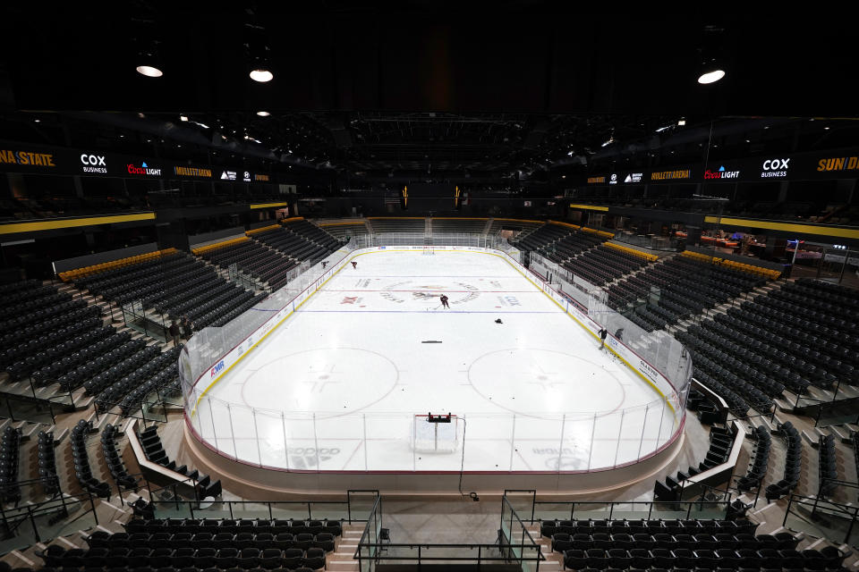 Members of the Arizona State University hockey team skate on the ice at the new Mullett Arena, Monday, Oct. 24, 2022, in Tempe, Ariz. The university will be sharing the arena with the Arizona Coyotes NHL hockey team. (AP Photo/Ross D. Franklin)