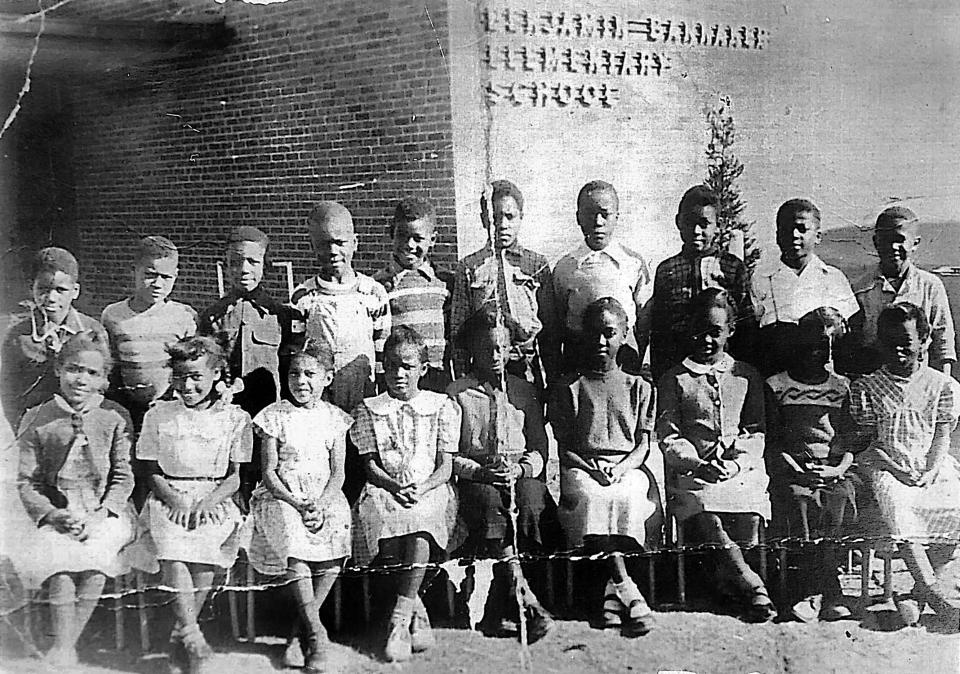 Students pose for a photograph at Benjamin Banneker Elementary School in the Walnut Grove area of Oklahoma City.