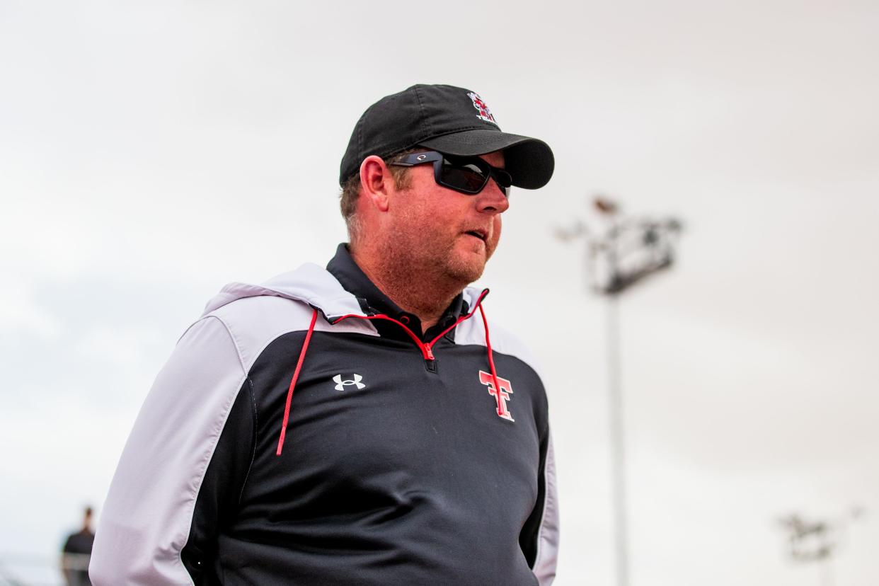 Texas Tech head coach Todd Petty looks on during the match against Oklahoma State on Friday, April 1, 2022, at McLeod Tennis Center in Lubbock, Texas.