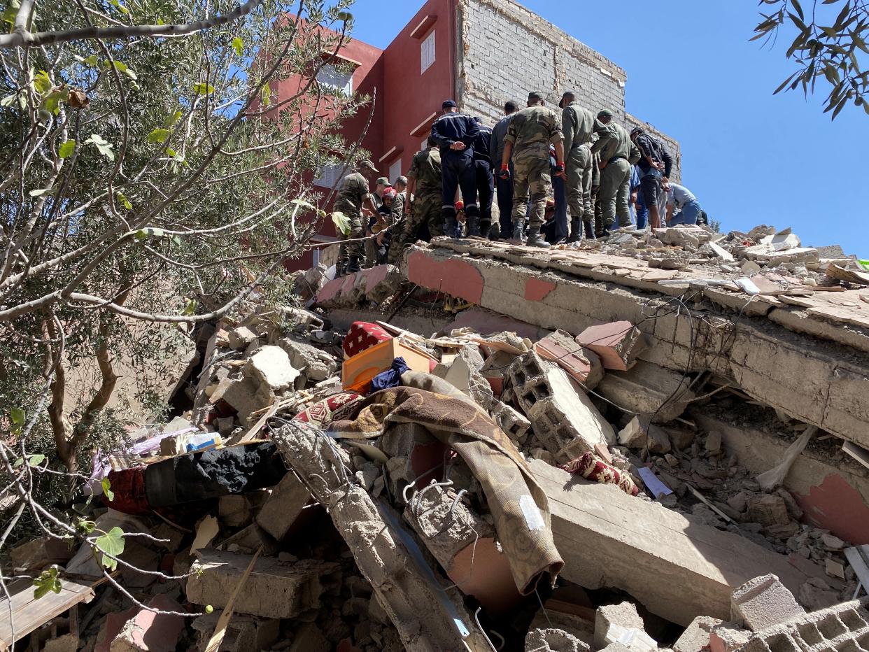 Rescuers carry a search operation following a powerful earthquake, in Amizmiz (Reuters)