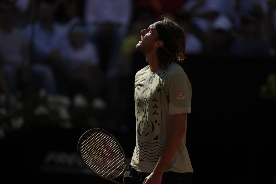 Greece's Stefanos Tsitsipas walks on the court during the final match against Serbia's Novak Djokovic at the Italian Open tennis tournament, in Rome, Sunday, May 15, 2022. (AP Photo/Alessandra Tarantino)