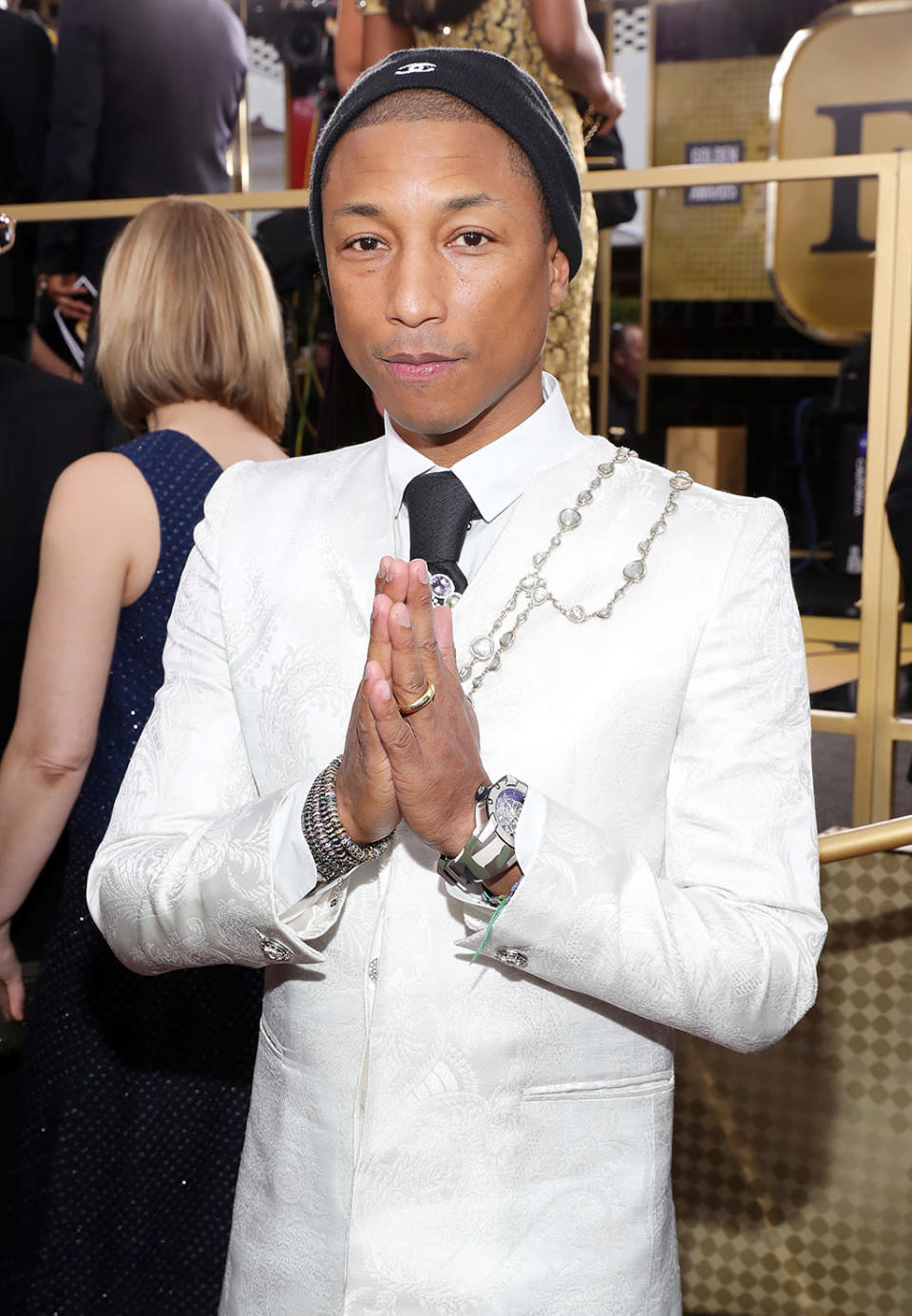 <p>Pharrell eschewed the standard black tux in favor of a cream-colored ensemble complete with a silver shoulder chain, which he completed with a Chanel beanie (because it’s what, 72 degrees in Los Angeles right now?). Somehow, because he’s Pharrell, he managed to pull it off. Jenna Bush might have been distracted by his snazzy outfit, though, since she mistakenly asked him about his (nonexistent) movie "Hidden Fences," instead of his very real movie, <i>Hidden Figures</i>. Oops! (Photo: Neilson Barnard/NBCUniversal/NBCU Photo Bank via Getty Images) </p>