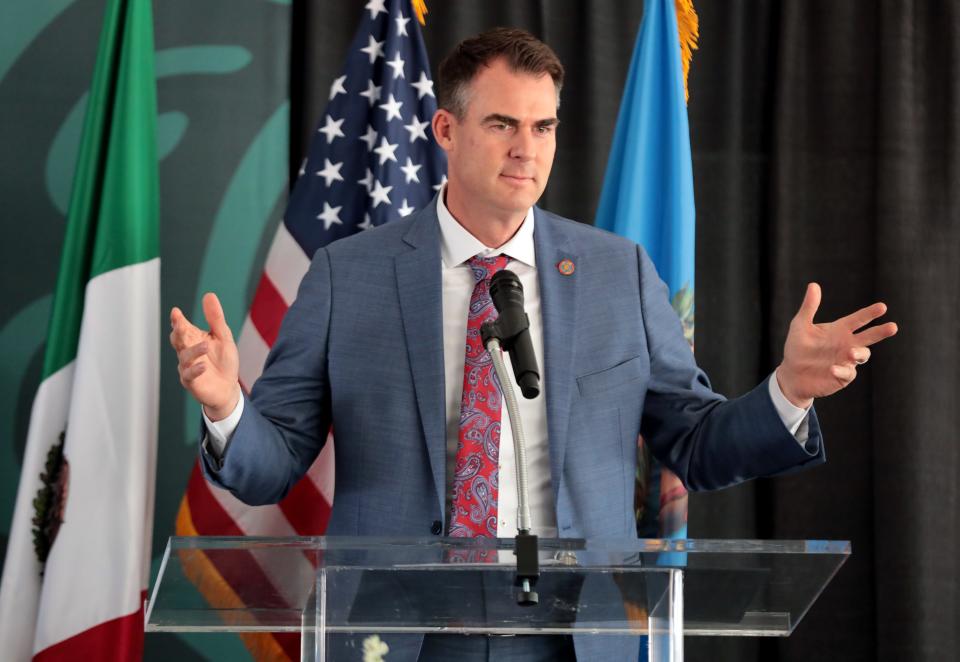 Gov. Kevin Stitt vetoed the creation of a special state license plate featuring the University of Kansas.
