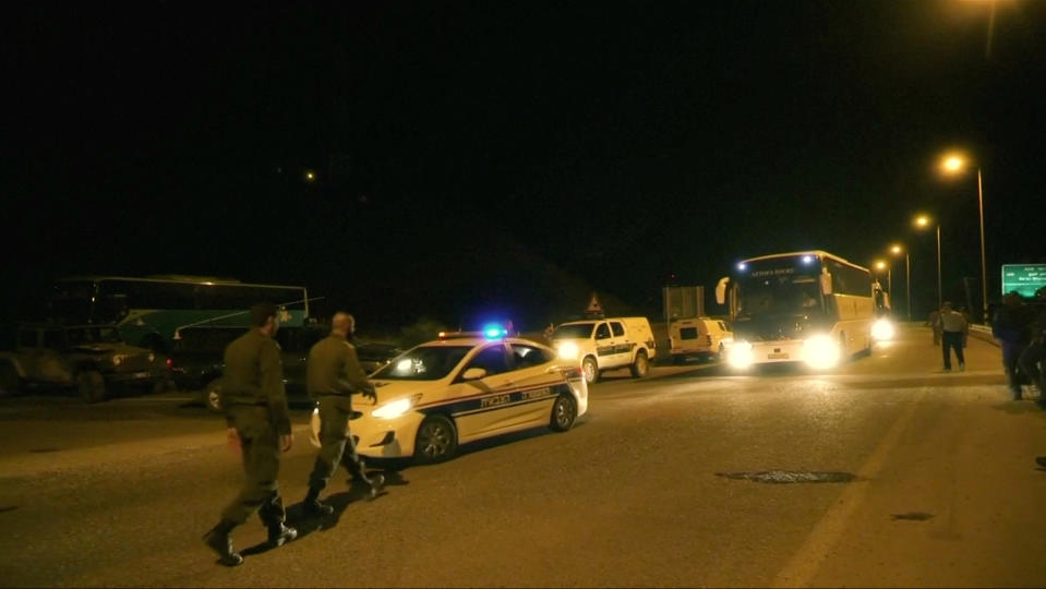 A general view of the transport convoy, during the Syria Civil Defence, also known as the White Helmets, extraction from the Golan Heights, Israel in this still image taken from video, provided by the Israeli Army July 22, 2018. Israeli Army Handout via REUTERS ATTENTION EDITORS - THIS IMAGE WAS PROVIDED BY A THIRD PARTY. RTV RESTRICTIONS: Broadcasters: NONE Digital: NONE . For Reuters customers only.